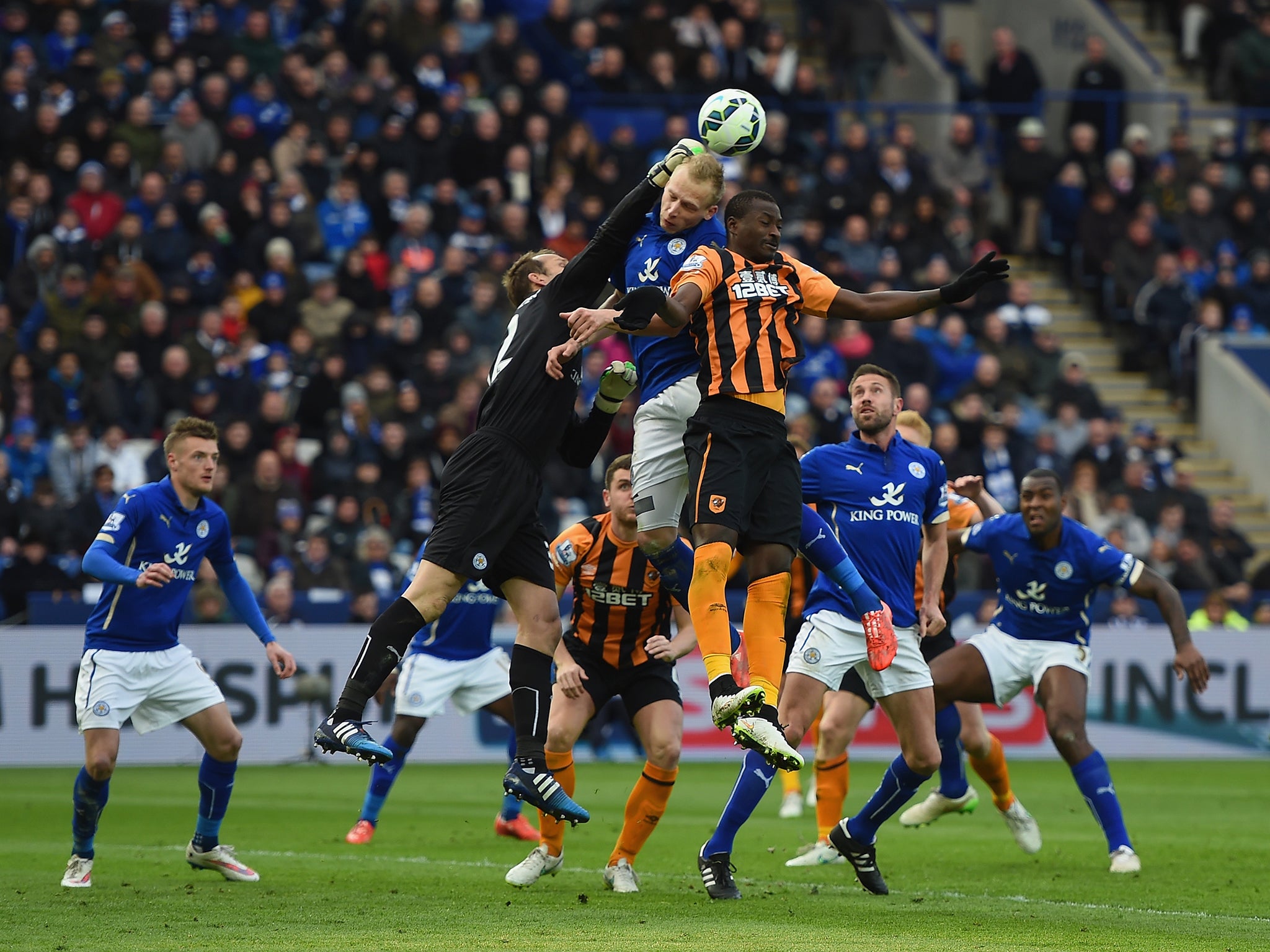 Mark Schwarzer punches the ball clear