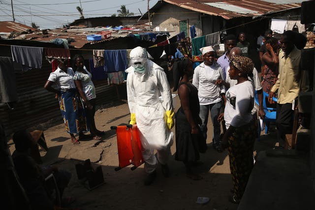 Health workers help tackle the Ebola outbreak in 2015.