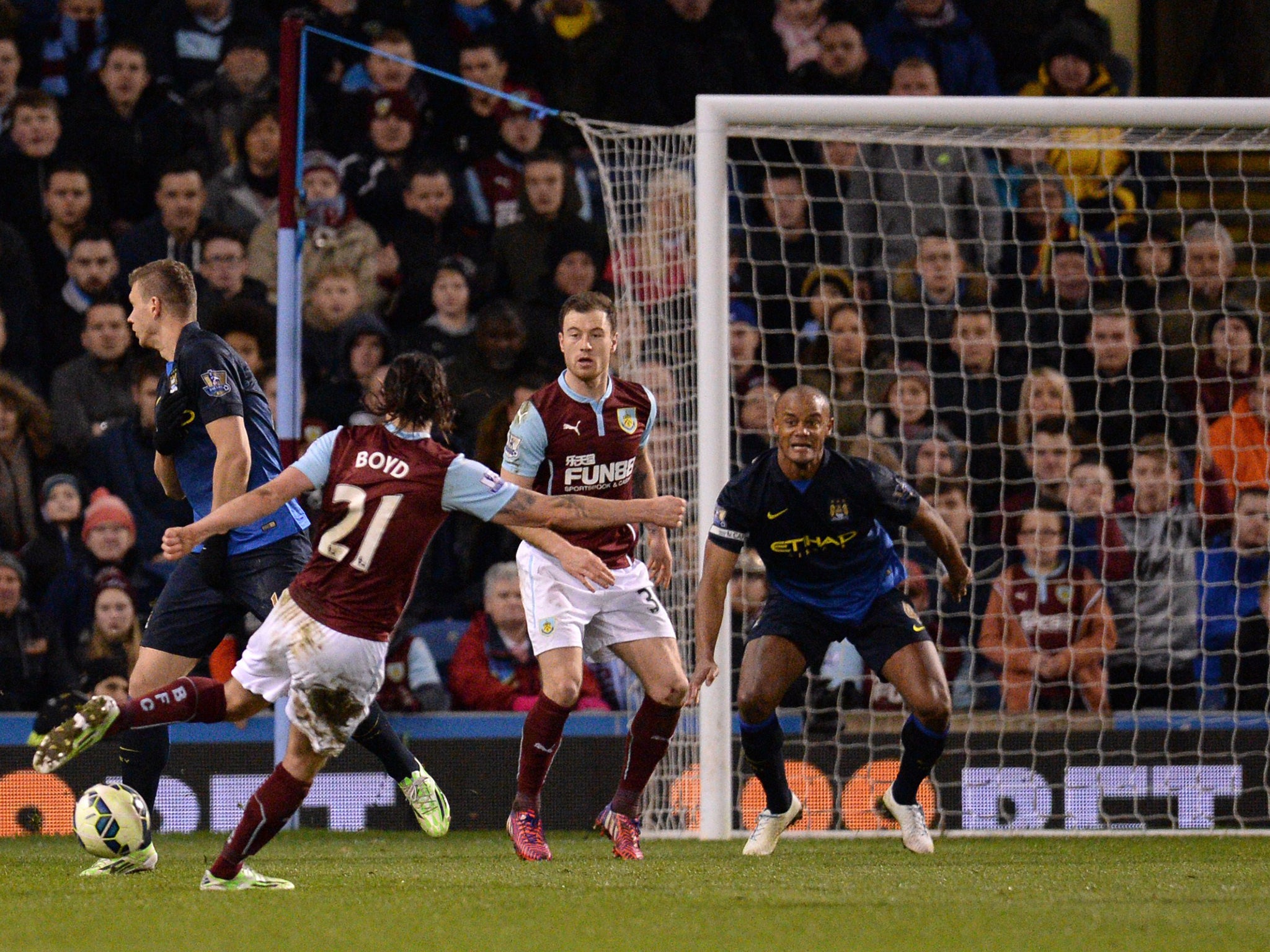 George Boyd (L) shoots to score the opening goal for Burnley