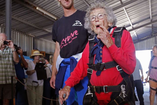 Centenarian Georgina Harwood, foreground, prepares with Jason Baker, for her tandem parachute jump forming part of her birthday celebrations