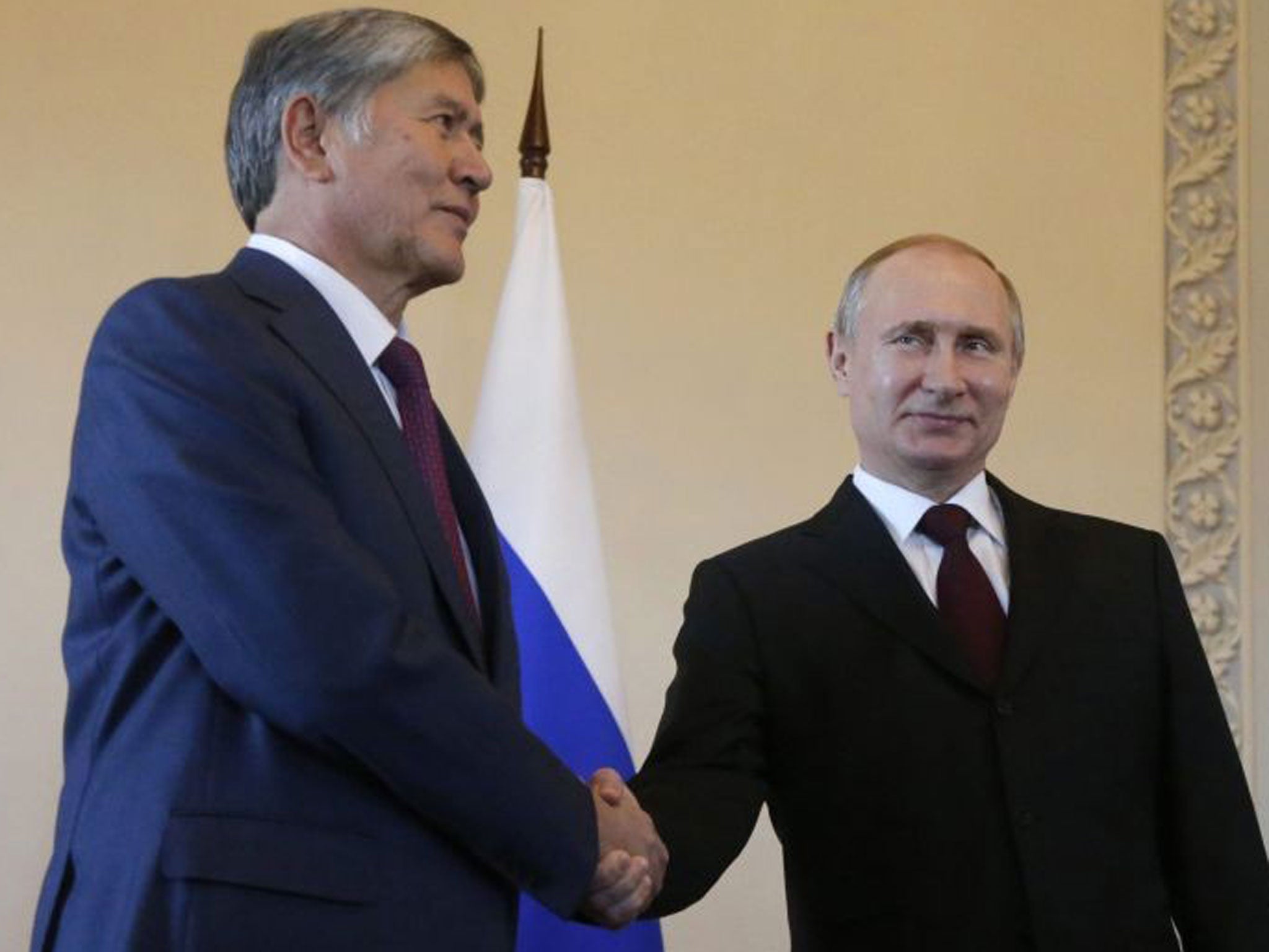 Russian President Vladimir Putin welcomes Kyrgyz' President Almazbek Atambayev