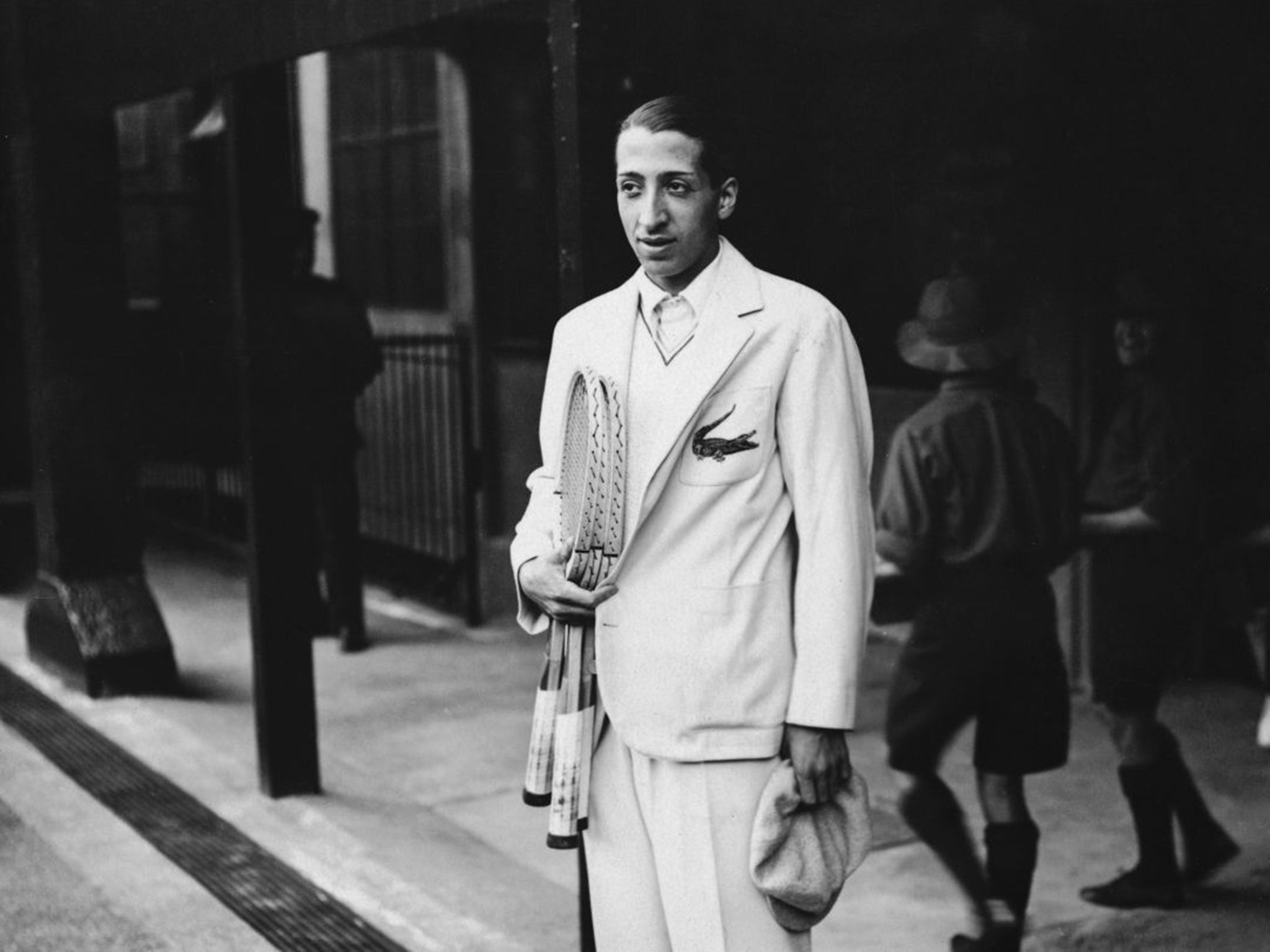 René Lacoste wearing his embroidered crocodile motif