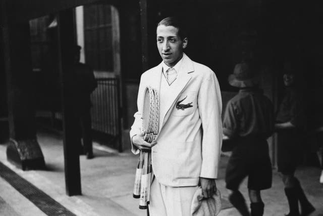 René Lacoste wearing his embroidered crocodile motif