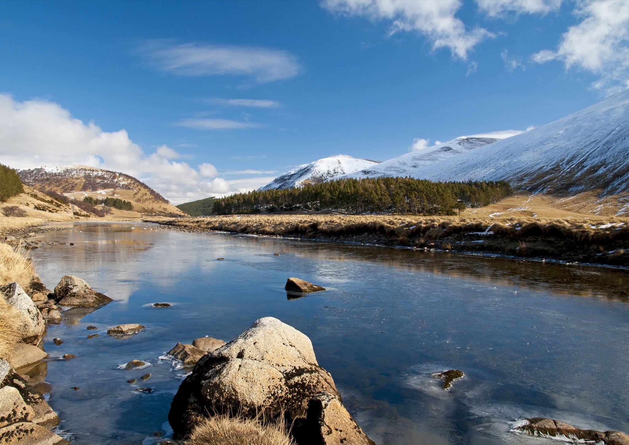 A river flows through the Monadhliath Mountains, where a wind farm has been proposed