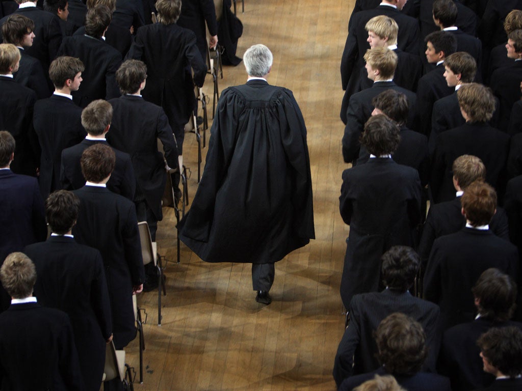 The boys of Eton College stand as headmaster Tony Little arrives for morning assembly