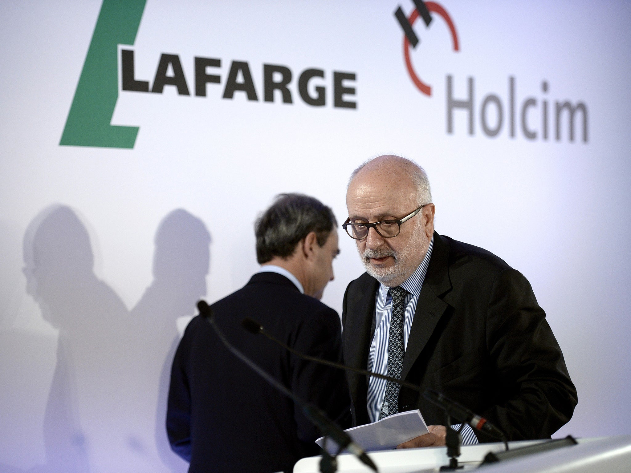 Rolf Soiron, right, chairman of the Board of Directors of Swiss firm, Holcim, with CEO of Lafarge, Bruno Lafont last year
