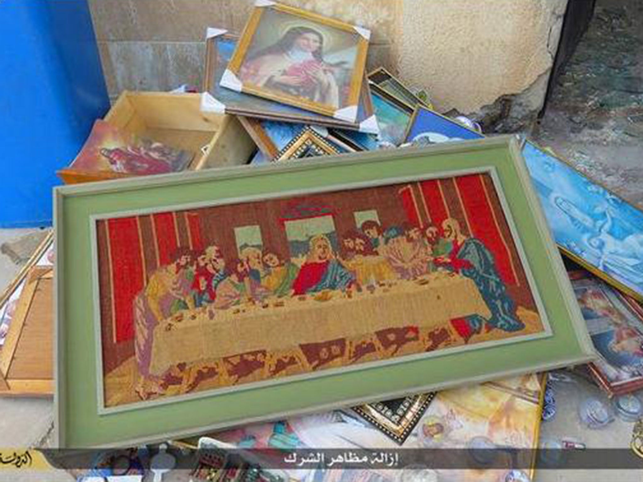 Pictures of the Last Supper and other biblical images were seen piled up