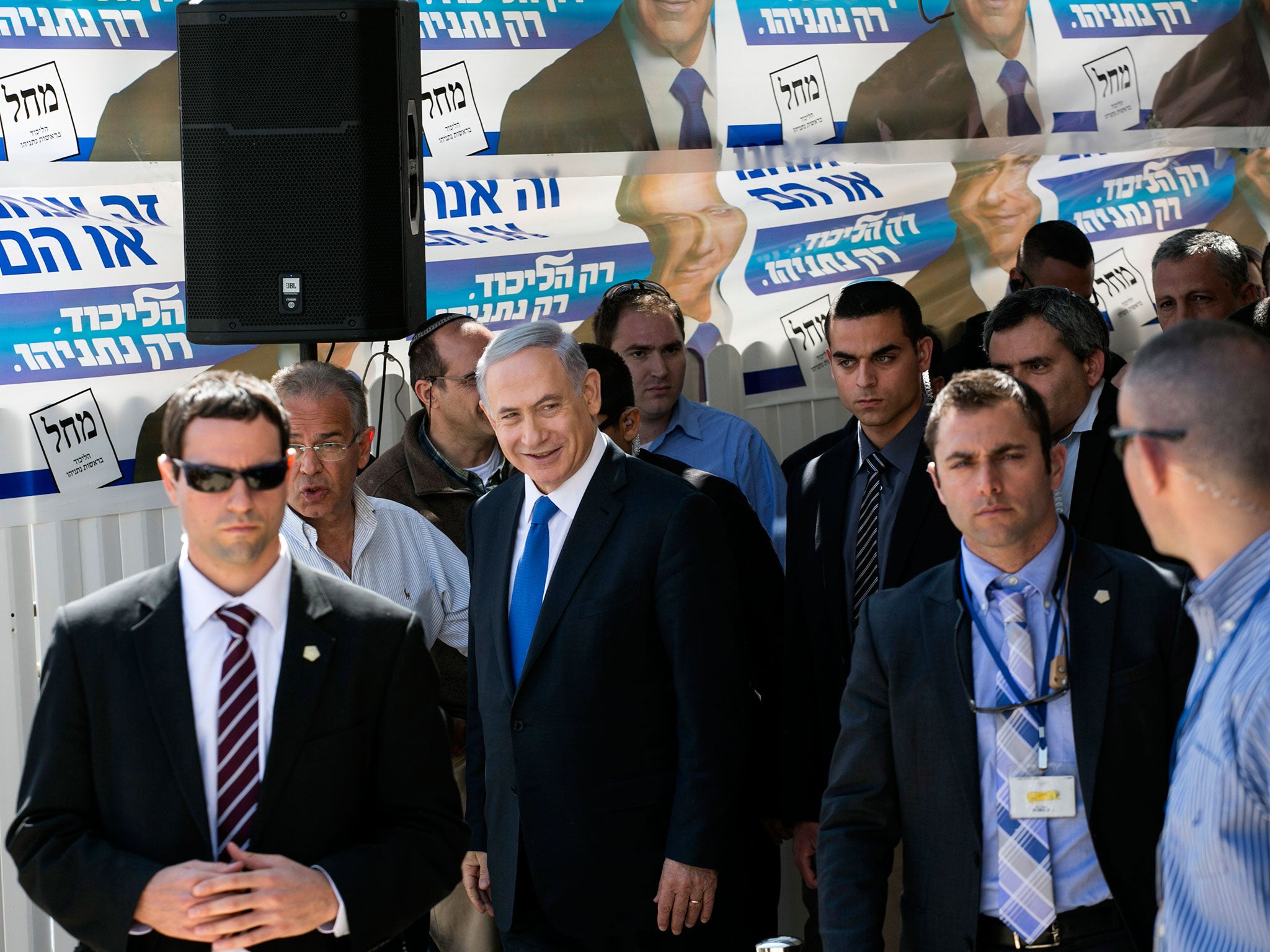 Israeli Prime Minister Benjamin Netanyahu, center, visits a construction site in Har Homa, east Jerusalem, a day ahead of legislative elections. Netanyahu is seeking his fourth term as prime minister