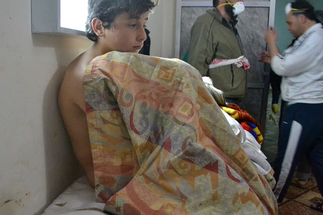 A young victim of a what is understood to be a gas attack by the Assad regime is treated in a clinic in the village of Sarmin in the province of  Idlib in north-western Syria in March 2015