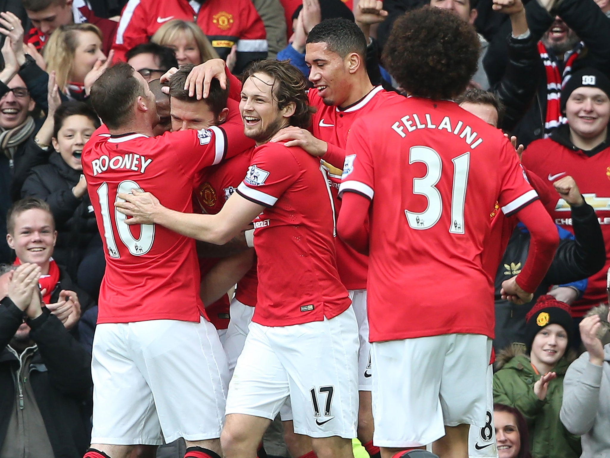 Michael Carrick is mobbed by his Manchester United team-mates after scoring against former side Spurs