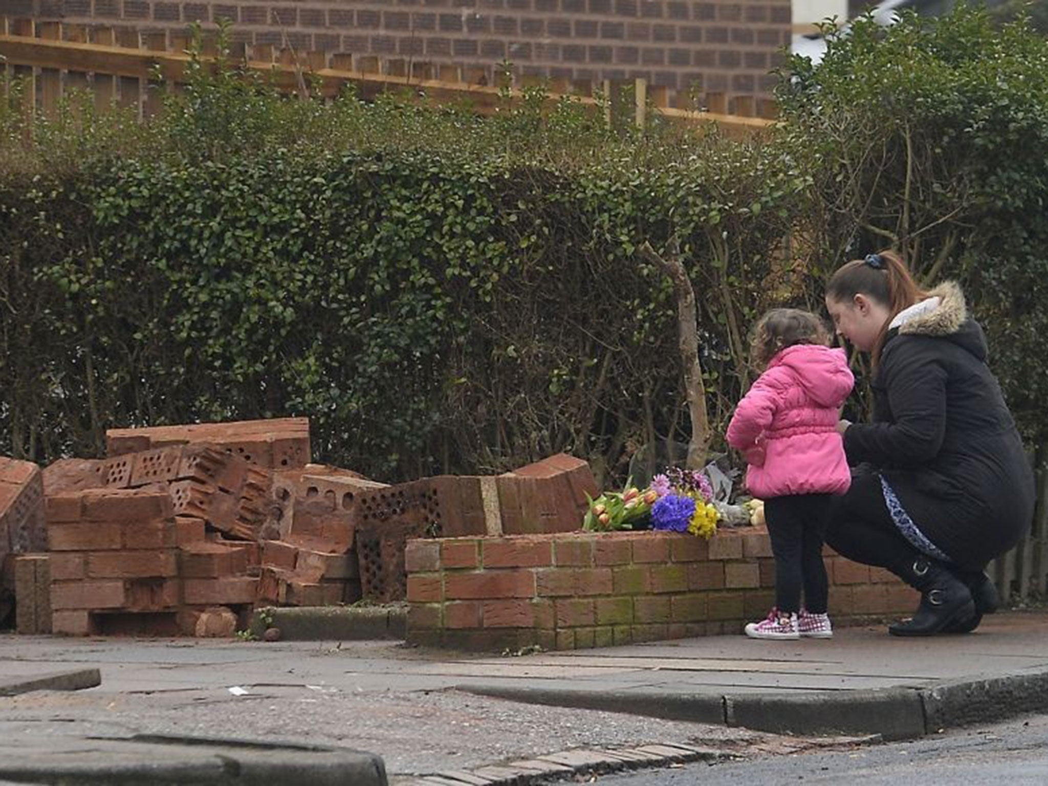 Mourners lay flowers at Queens Road in Stechford, Birmingham, where a one-year old boy was killed after a recovery truck hit a wall
