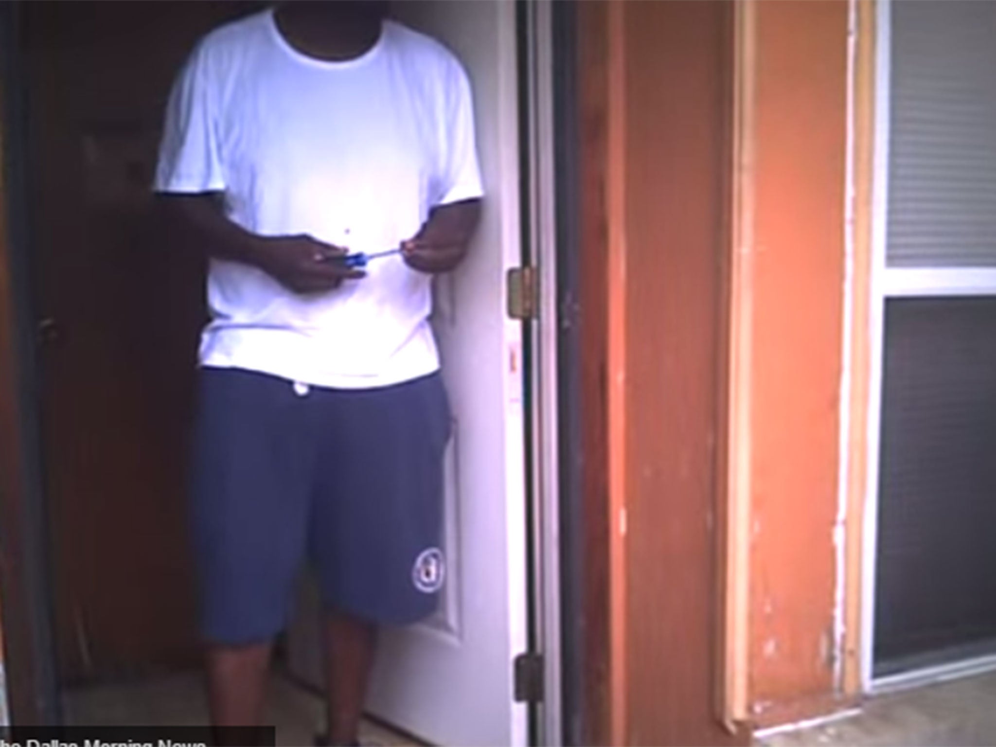 Harrison stood in the doorway holding a screwdriver