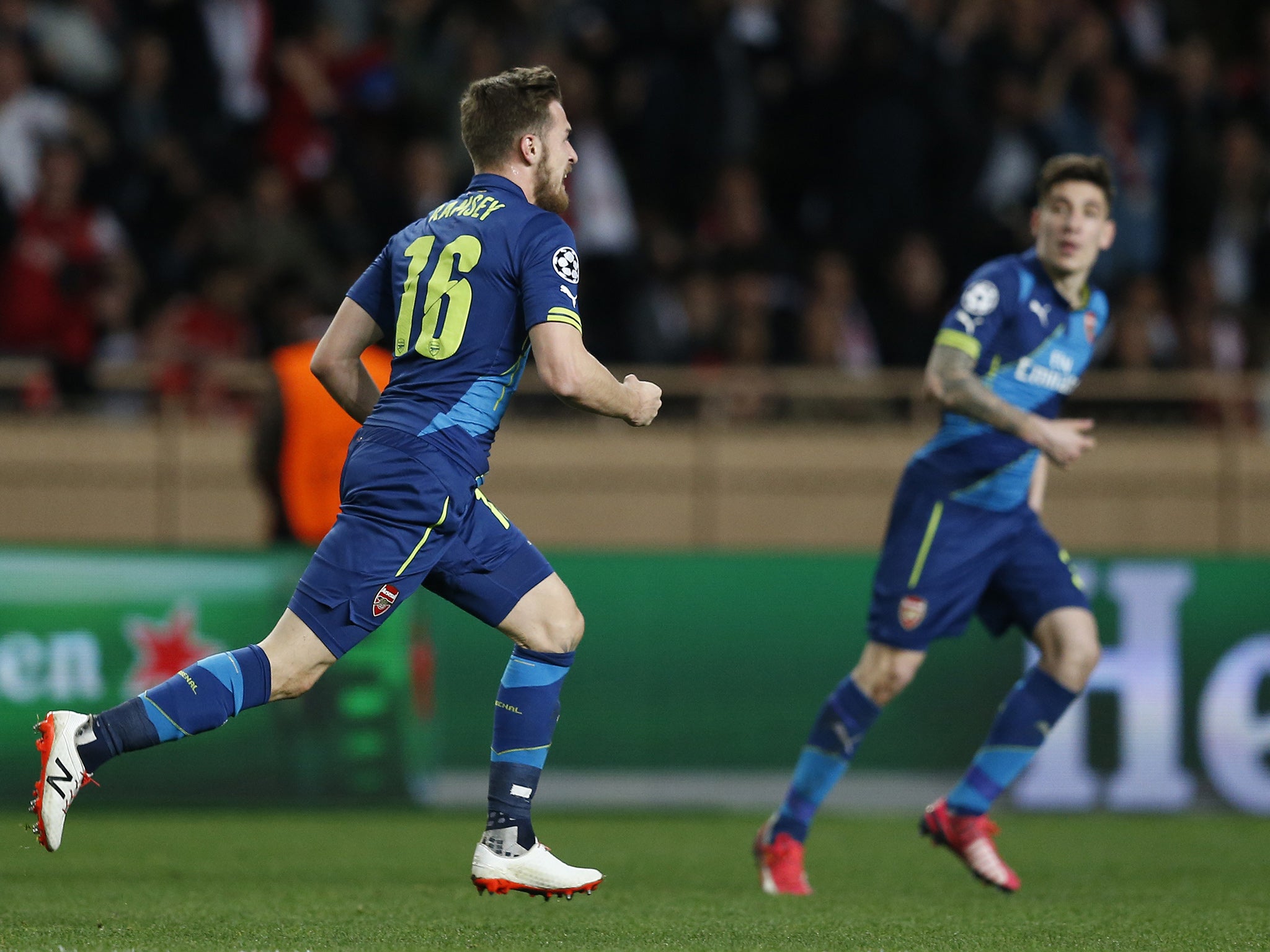 Aaron Ramsey wheels away in celebration after scoring Arsenal's second