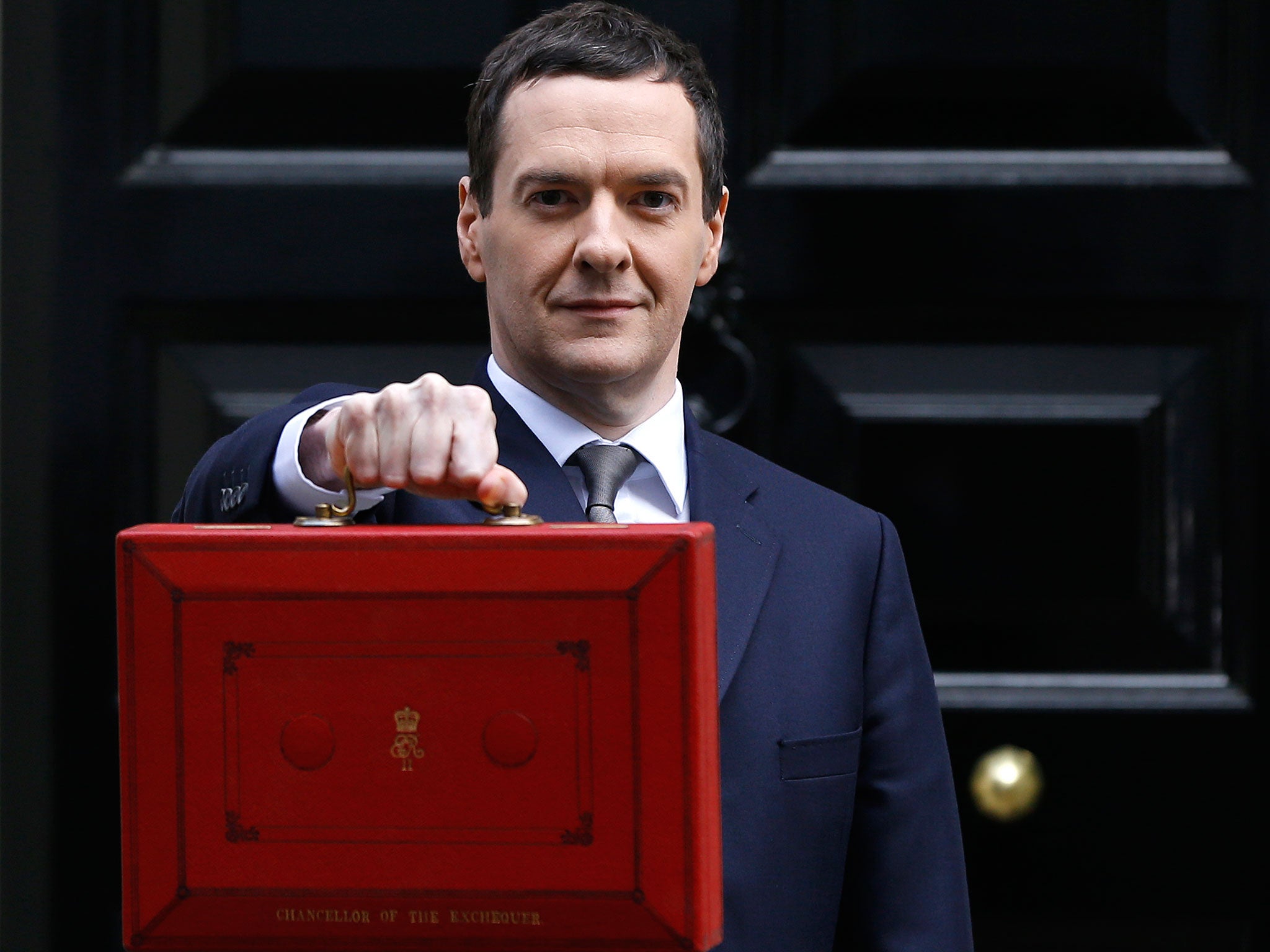 Britain's Chancellor George Osborne stands with the traditional red dispatch box outside his official residence at 11 Downing Street in London, prior to unveiling the budget