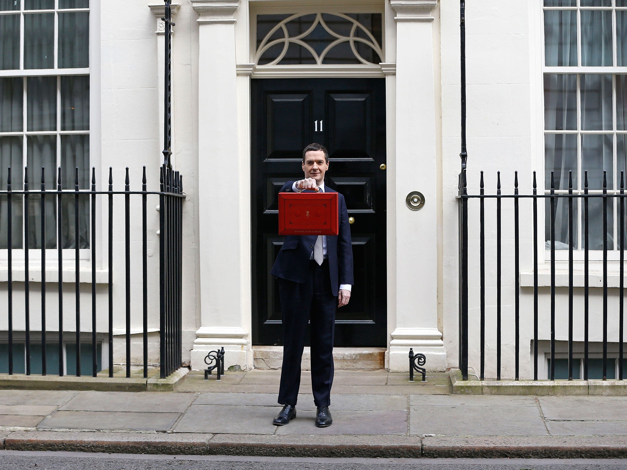 Britain's Chancellor George Osborne stands outside his official residence at 11 Downing Street in London, prior to unveiling the budget