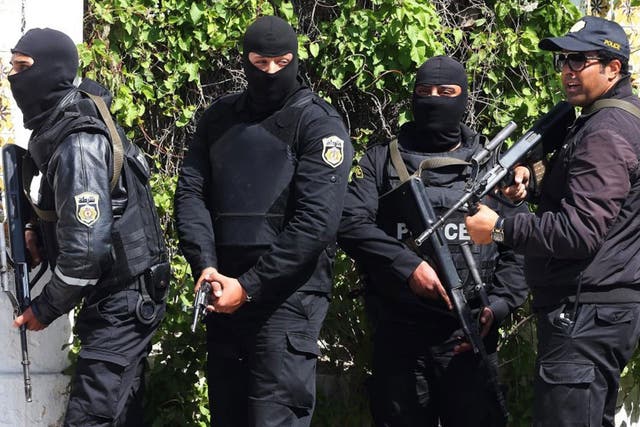 Members of the Tunisian security services take up positions after gunmen reportedly took hostages near the country's parliament, outside the National Bardo Museum, Tunis, Tunisia, 18 March 2015. According to local reports eight people were killed, mostly 