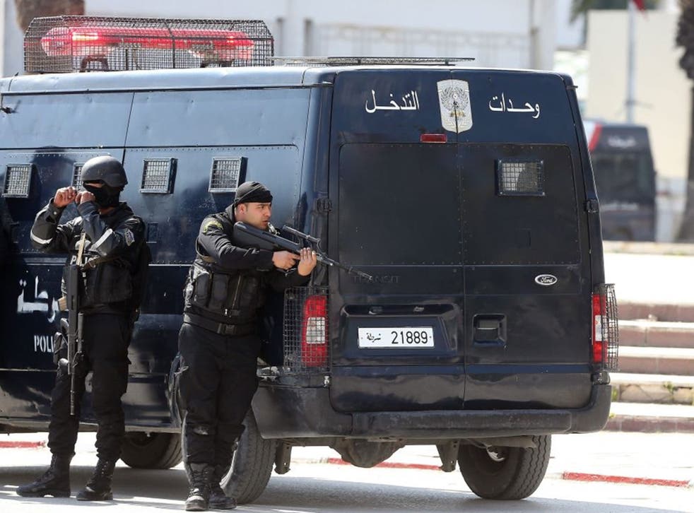Members of the Tunisian security services take up a position outside the National Bardo Museum, near the country's parliament after gunmen reportedly took hostages at Tunisia museum in Tunis,Tunisia on 18 March 2015  