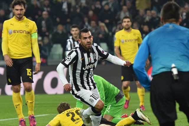 Juventus forward Carlos Tevez celebrates his goal against Borussia Dortmund in the first leg