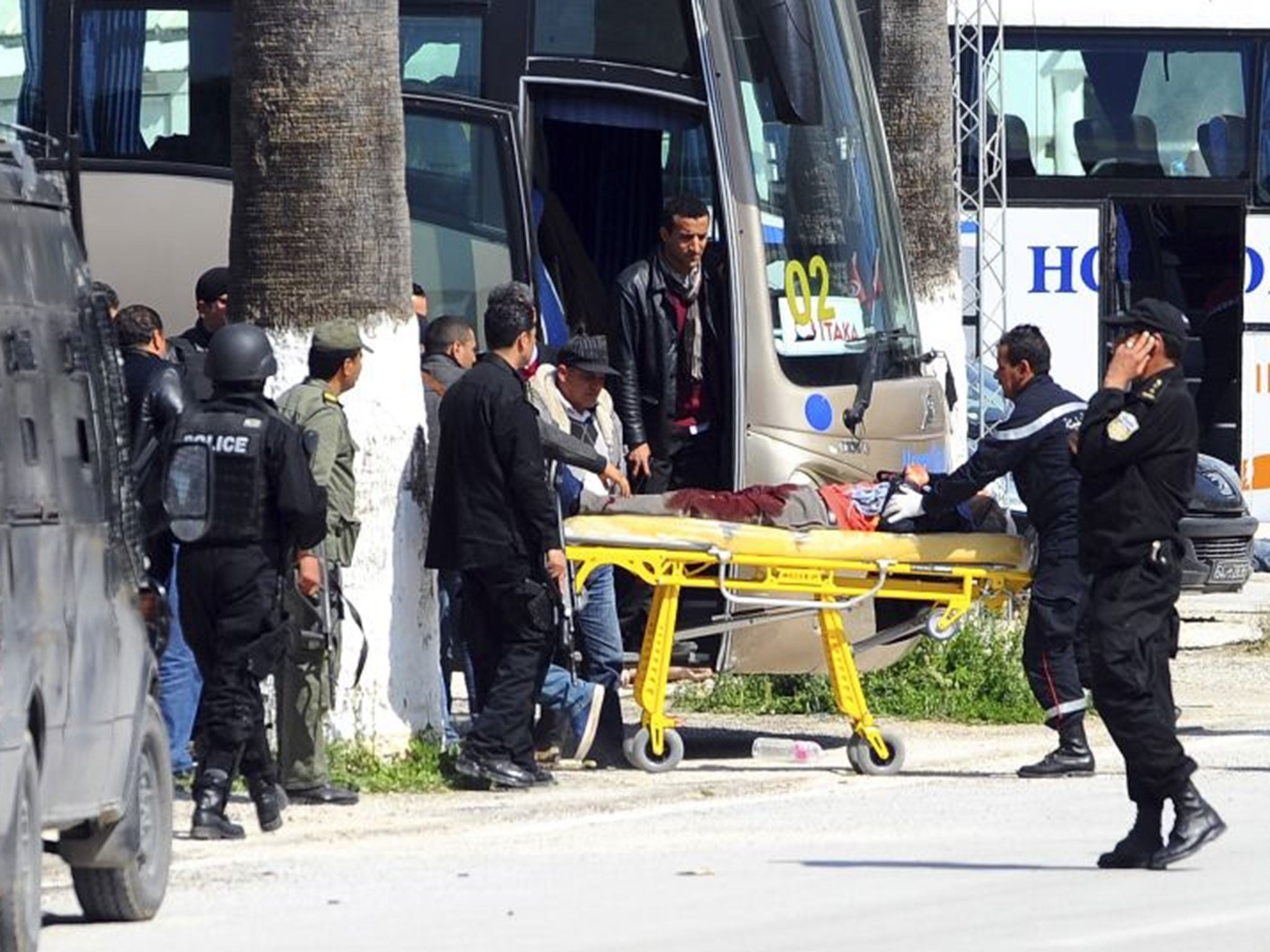 A victim is being evacuated from the Bardo museum are evacuated in Tunis, Wednesday, March 18, 2015 in Tunis,