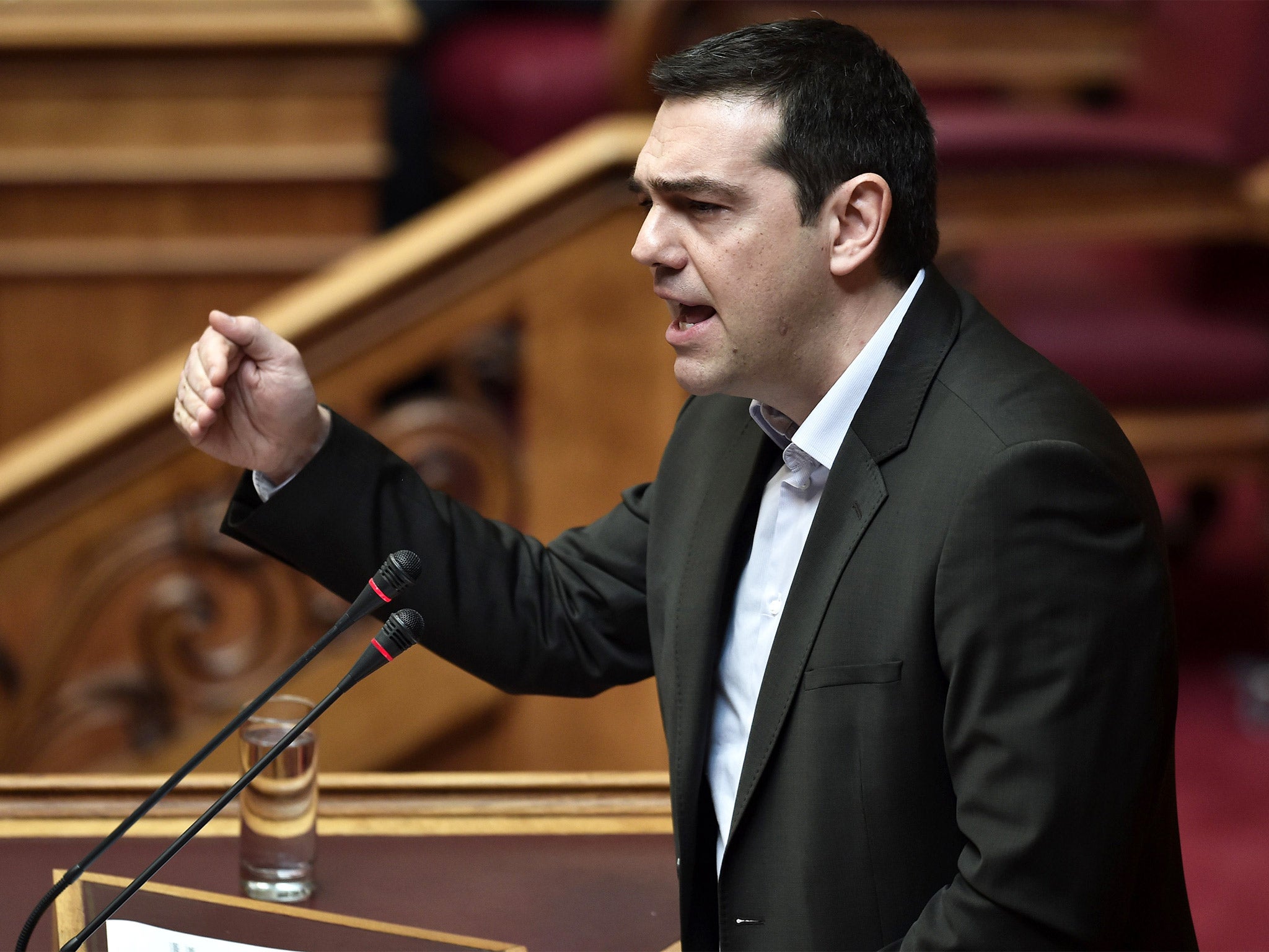 Greek Prime Minister Alexis Tsipras addresses parliament in Athens