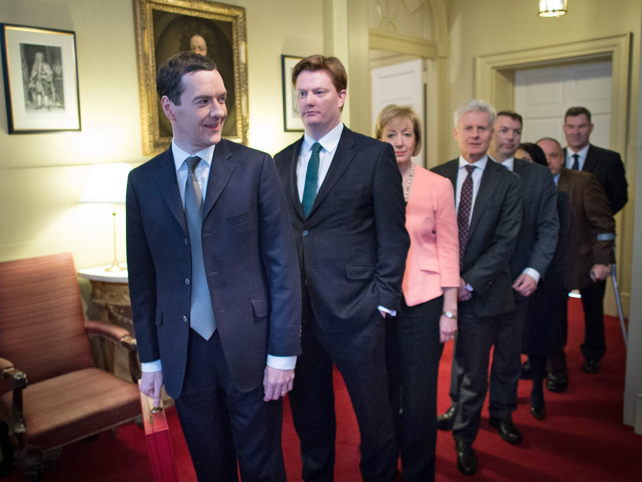 Chancellor George Osborne, Chief Secretary to the Treasury Danny Alexander and their treasury team leave 11 Downing Street, London, before heading to the House of Commons to deliver the annual Budget statement