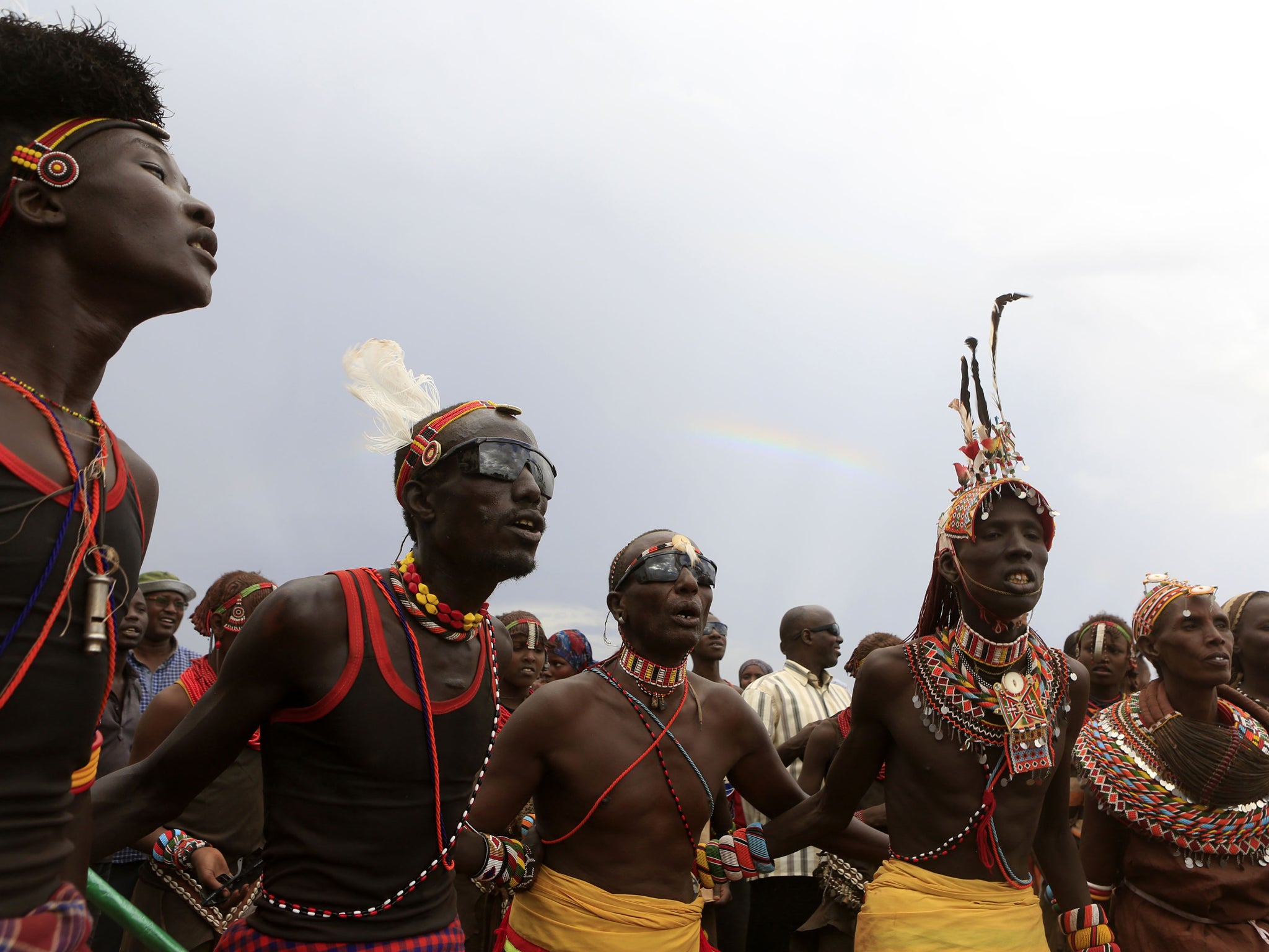 Turkana men dance and sing during the hybrid solar eclipse at the remote Sibiloi National Park on the shore of Lake Turkana, November 3, 2013