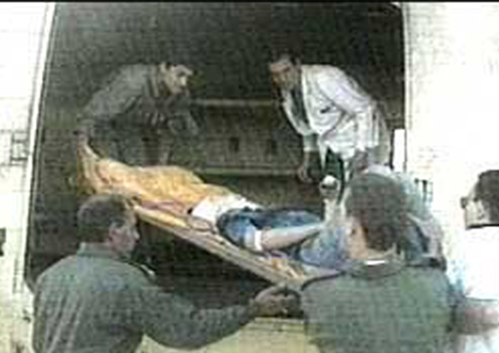 Egyptian emergency workers treat a victim of the 1997 Luxor attack