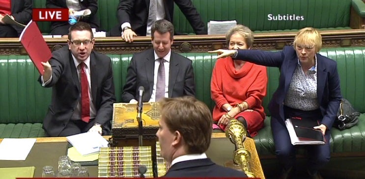 Shadow minister Andrew Gwynne waves the Budget Red Book to mock Danny Alexander