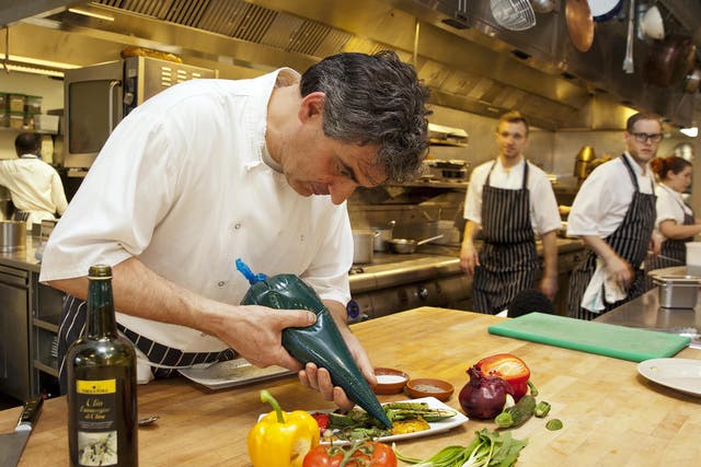 Bruno Loubet puts the finishing touches to a vegetable dish at the Grain Store in King's Cross
