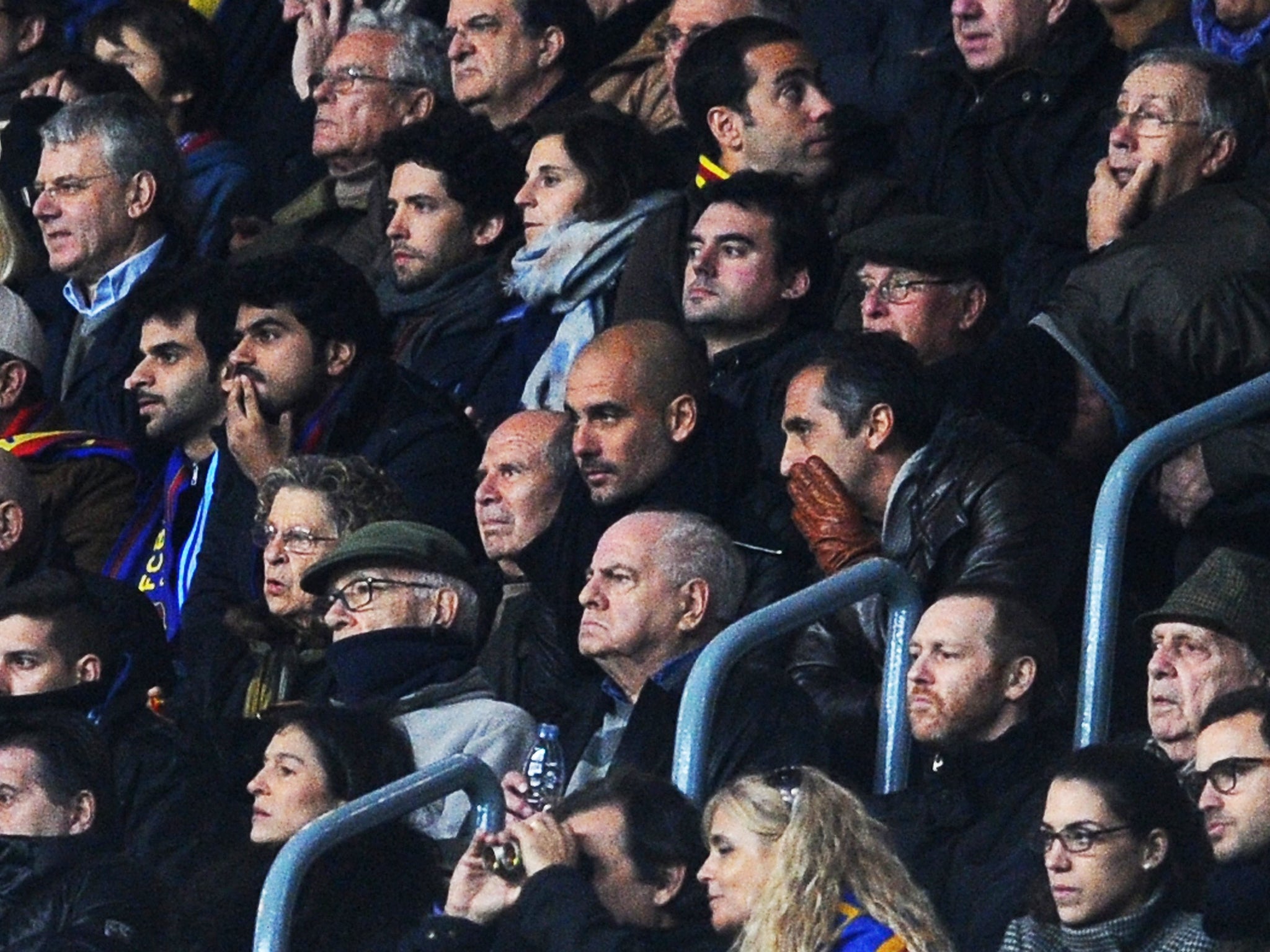 Pep Guardiola (centre) watches Barcelona against City on Wednesday night