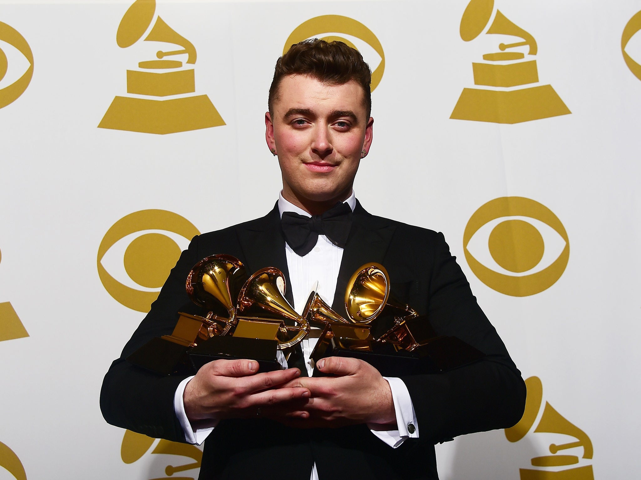 Sam Smith holds his Grammy awards