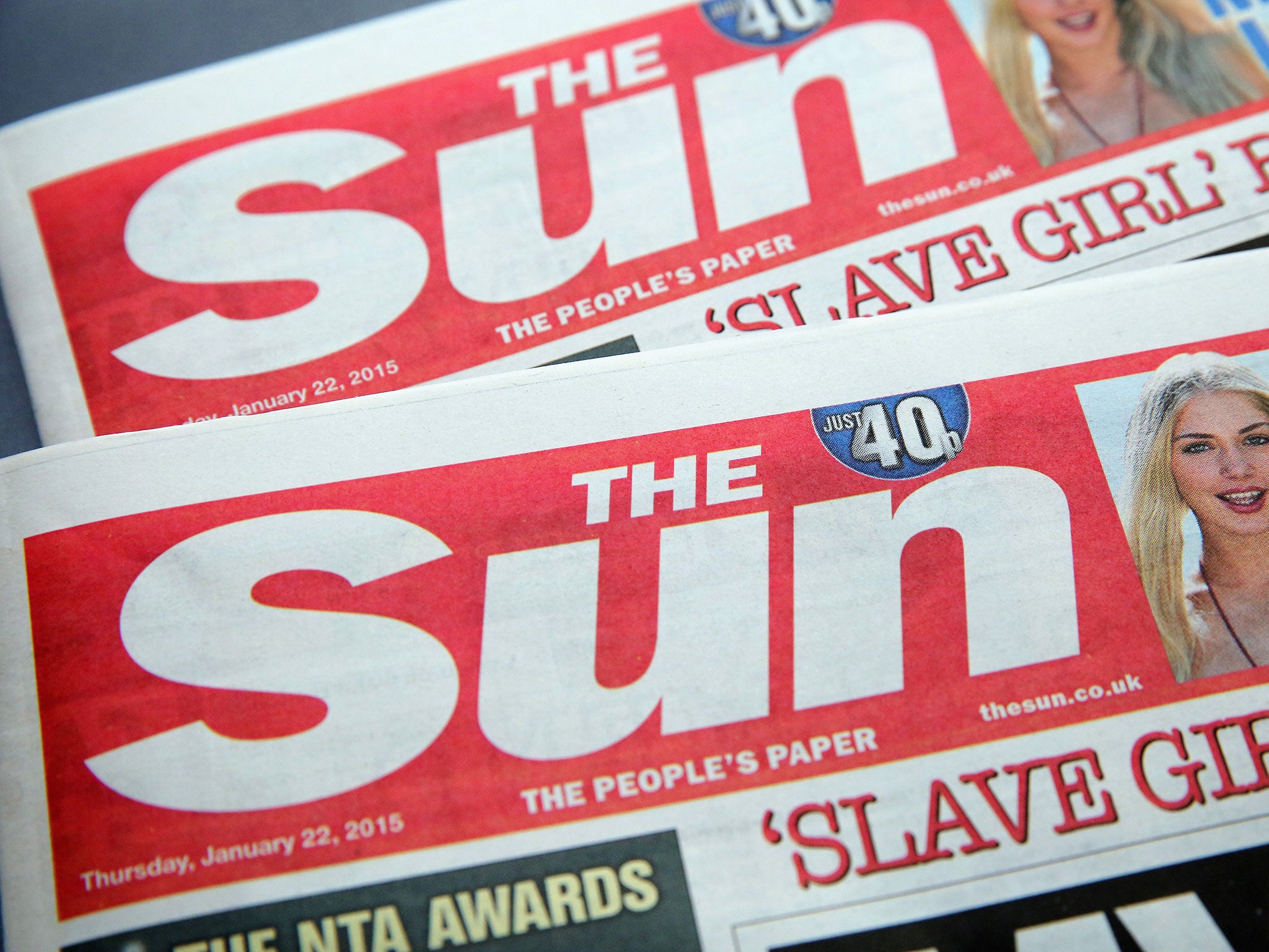 Four Sun journalists have been cleared of paying public officials.