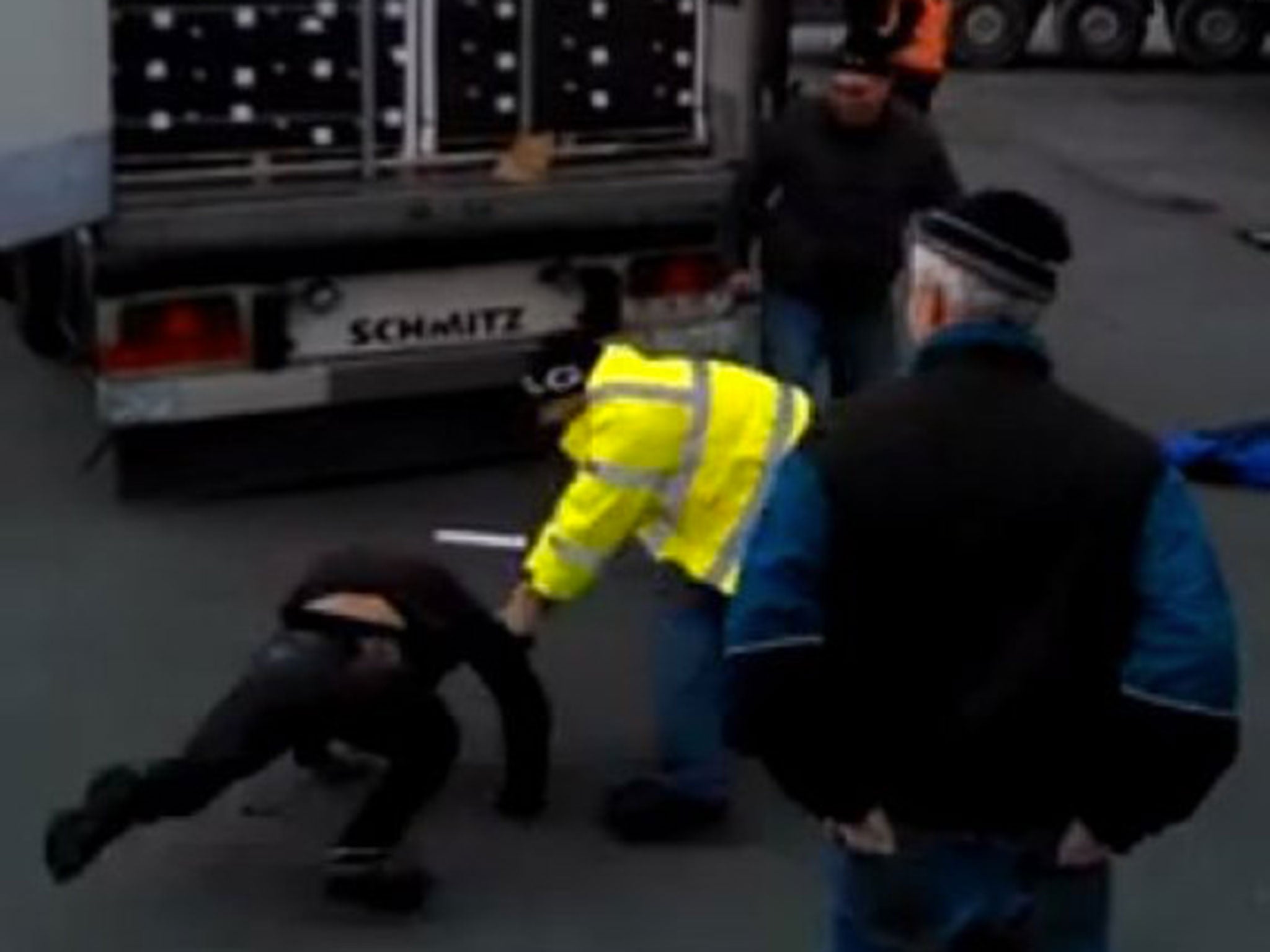 The video saw the man in the yellow jacket kick and punch those men pulled out of the lorry