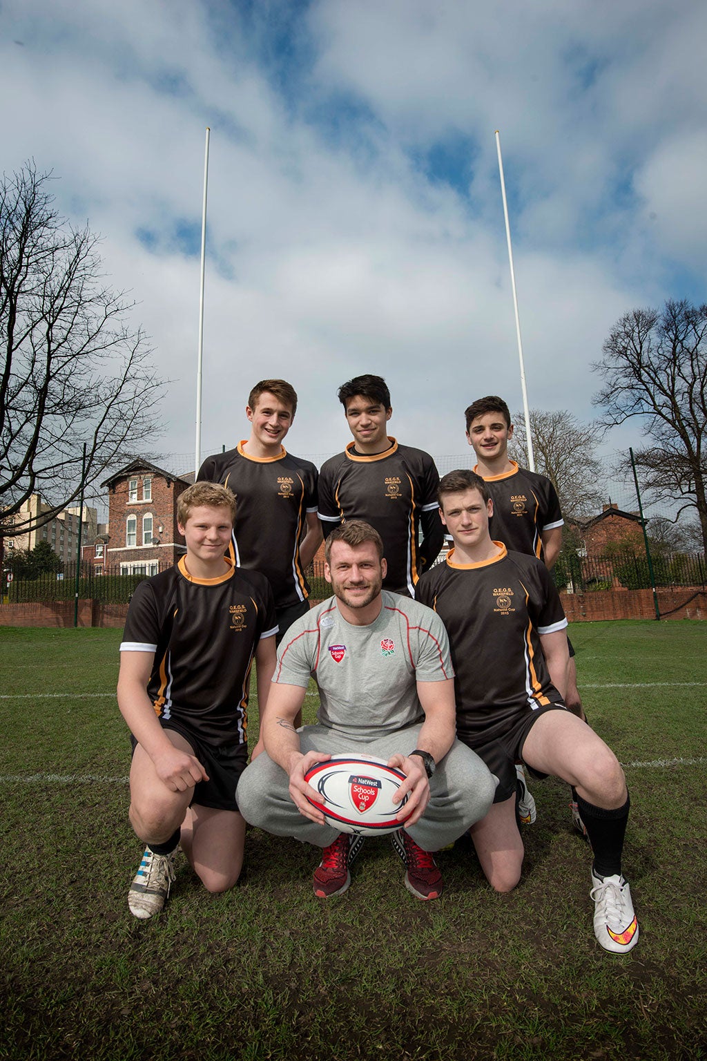 Cueto alongside members of the QEGS Wakefield School rugby team