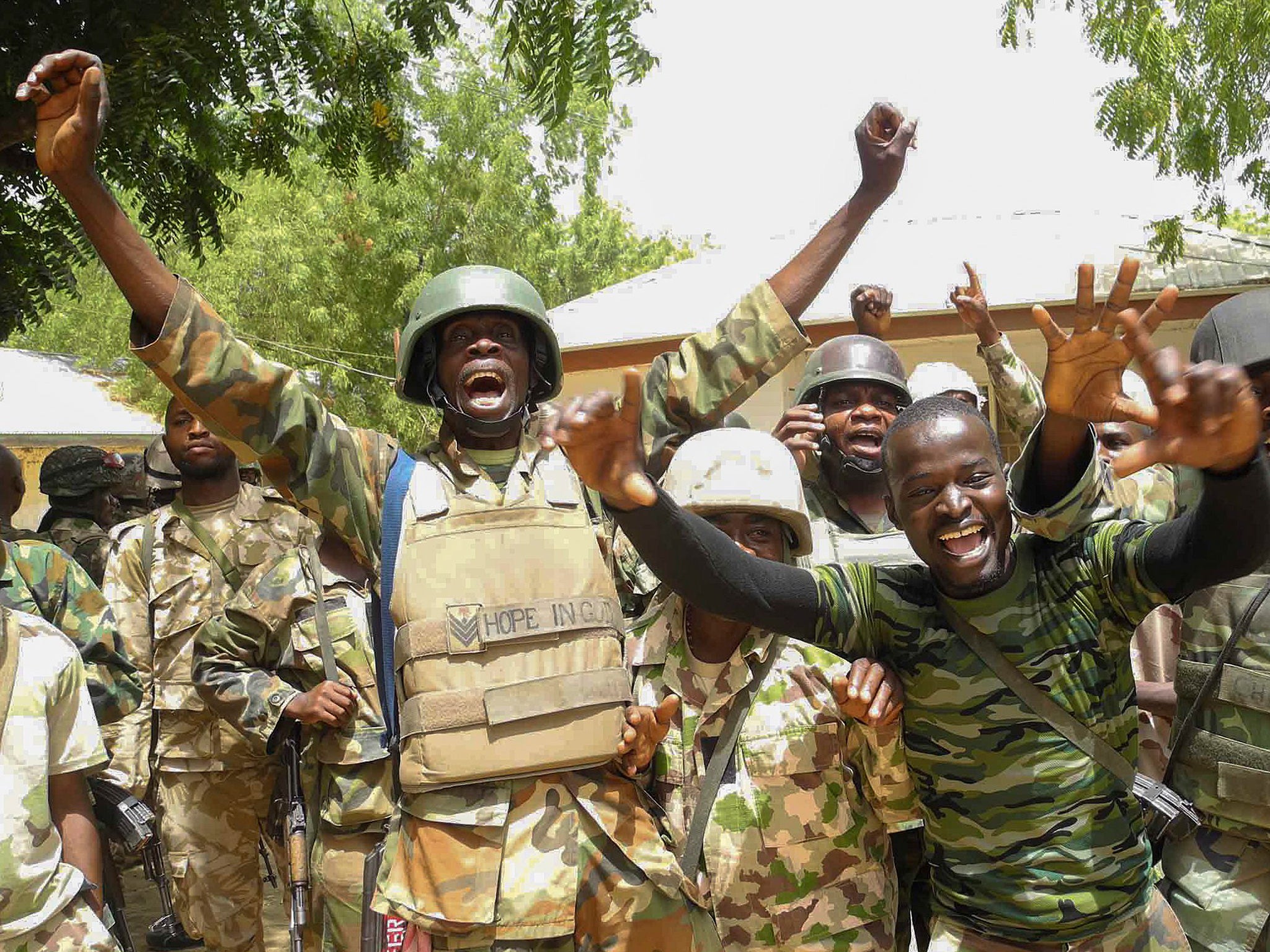 Nigerian soldiers jubilating after recapturing areas of Baga, North East Nigeria