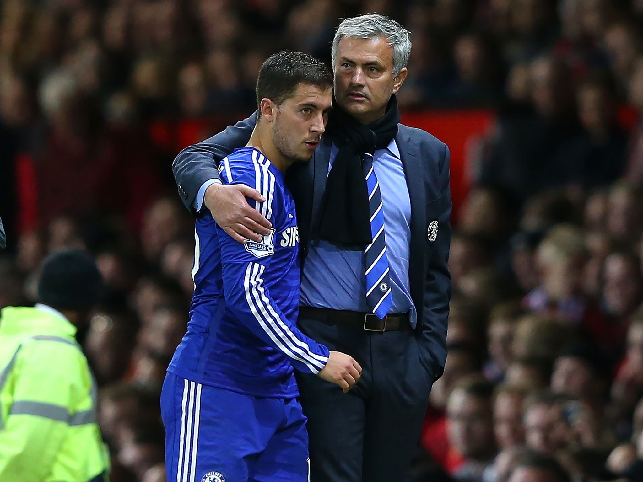 Jose Mourinho puts a consoling arm around Eden Hazard