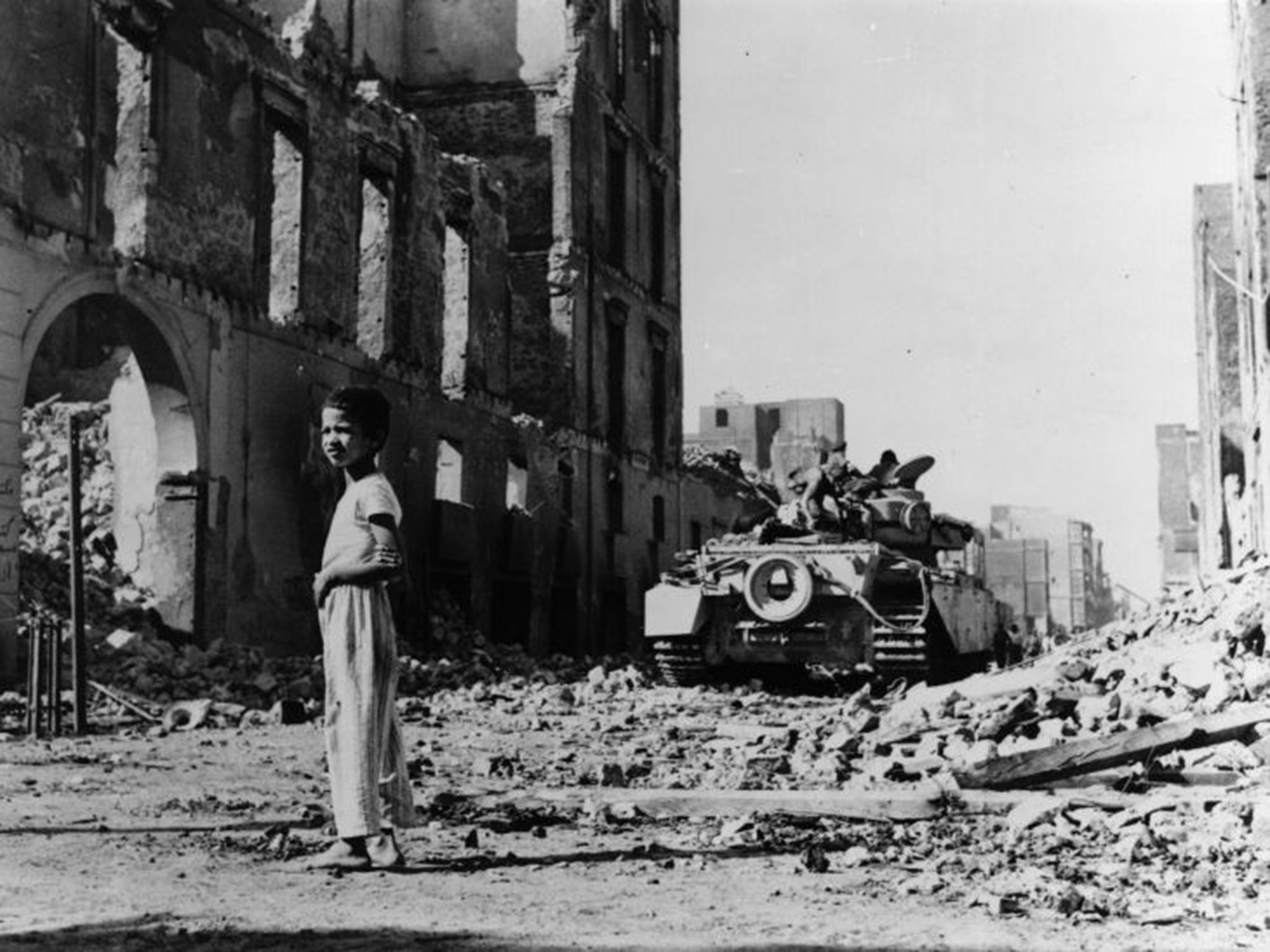 A British tank in a destroyed Egyptian street during the 1956 Suez crisis