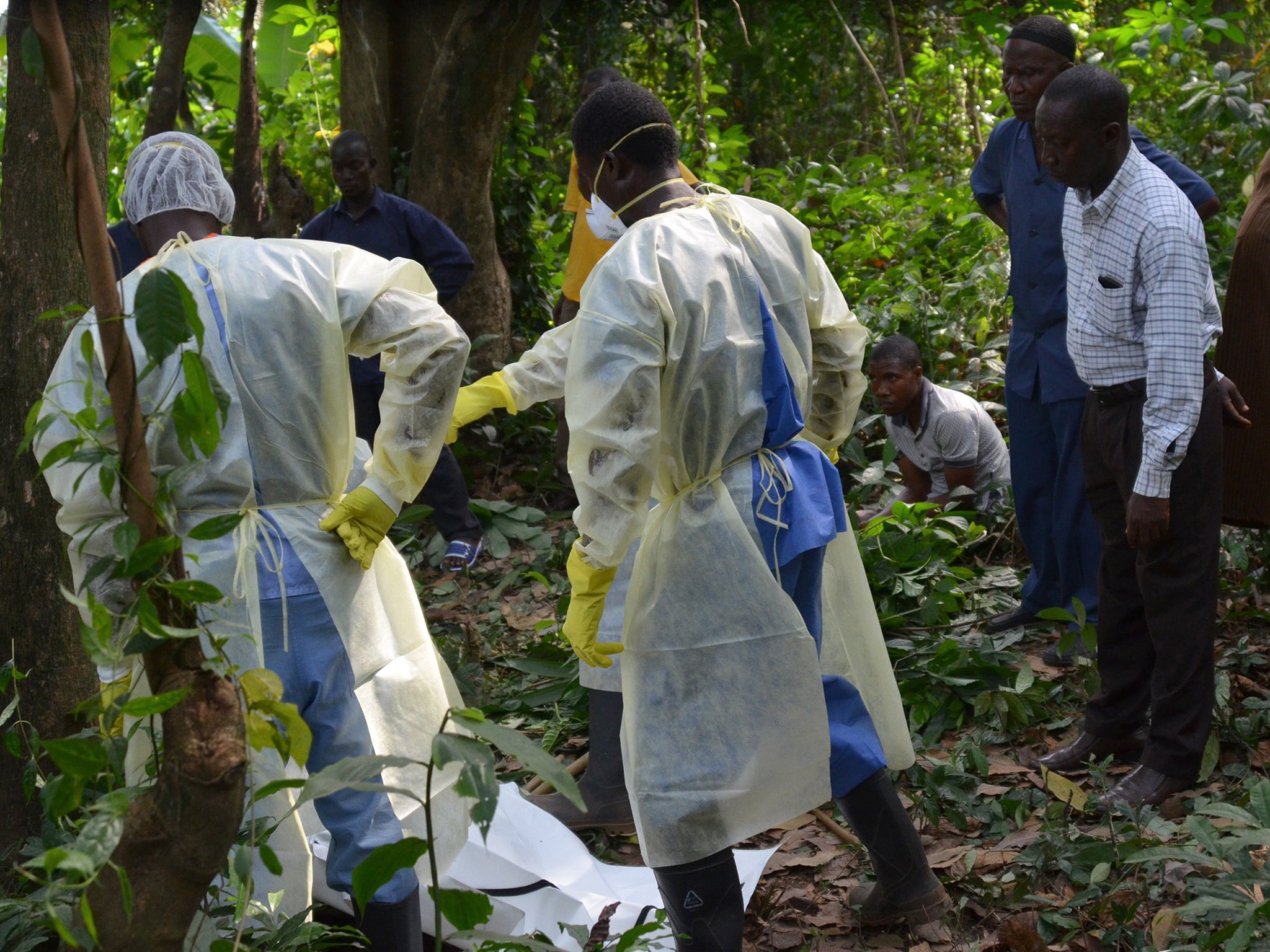 Red Cross workers prepare to bury a victim of Ebola (AFP/Getty)