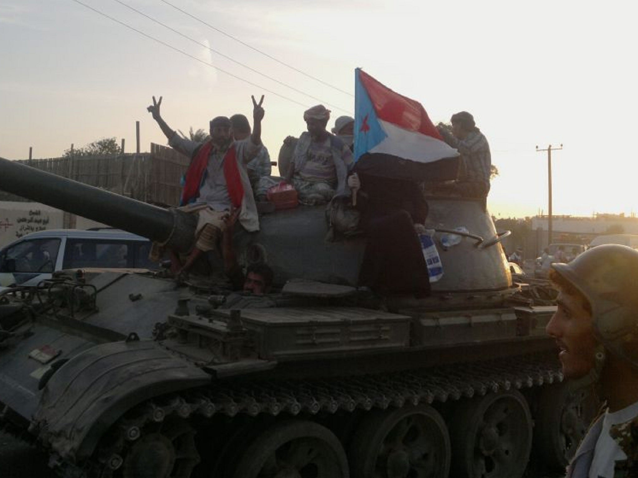 Soldiers loyal to expelled president Hadi ride on a tank in Aden, Yemen