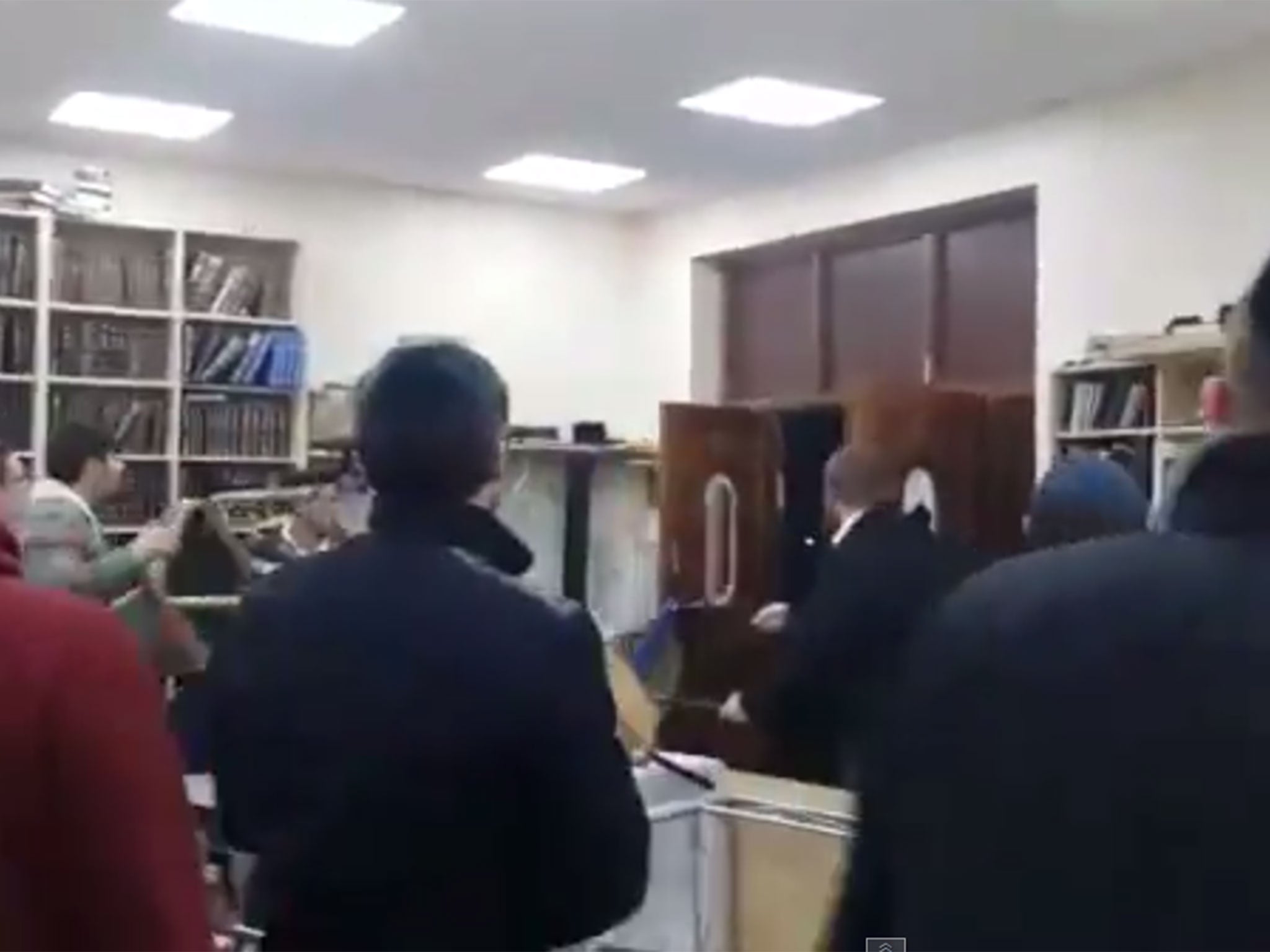 The video, taken from inside the synagogue, appears to show an attack by a gang of drunk men