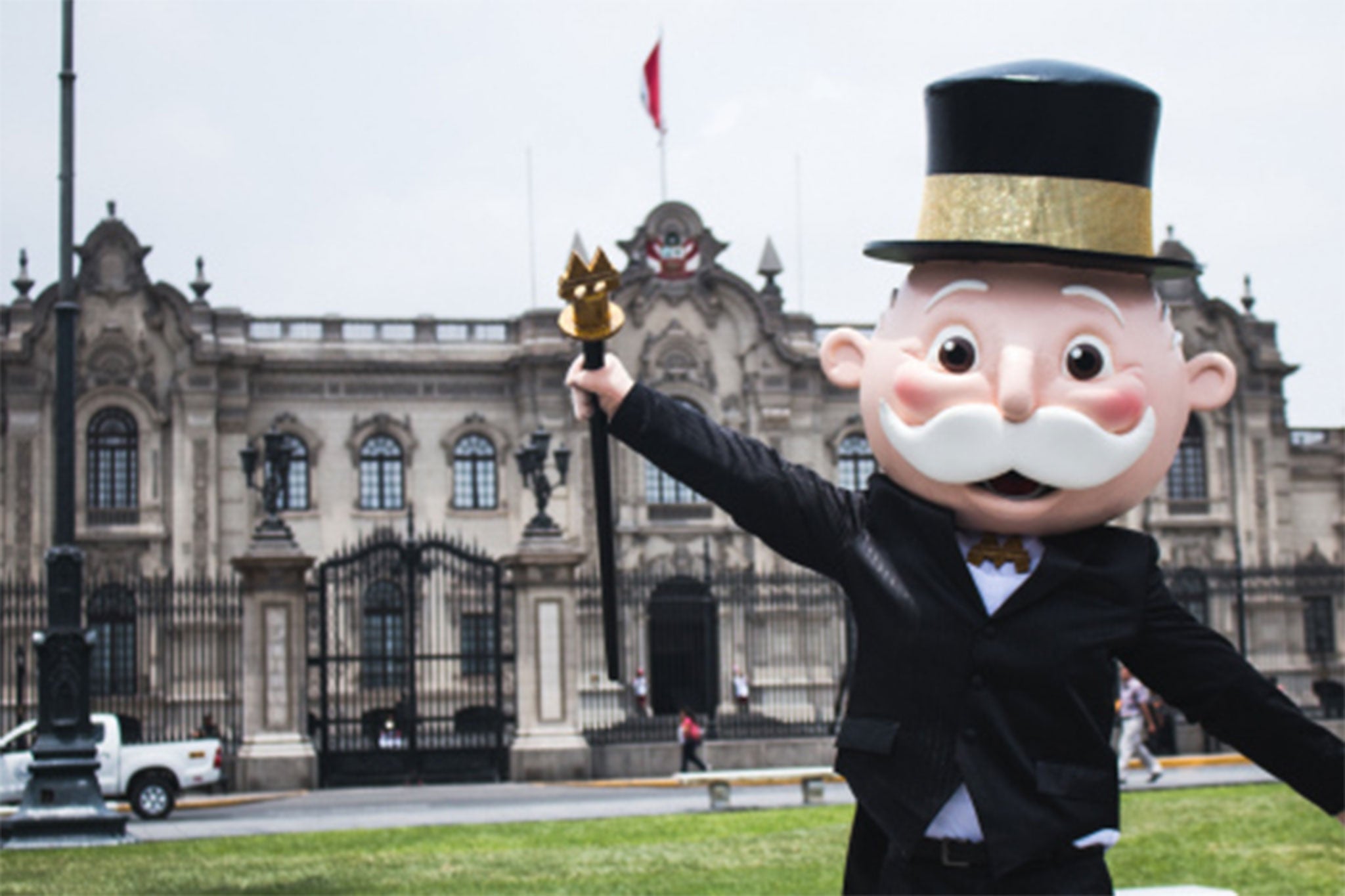 Mr Monopoly celebrates in front of the Government Palace of Peru in Lima