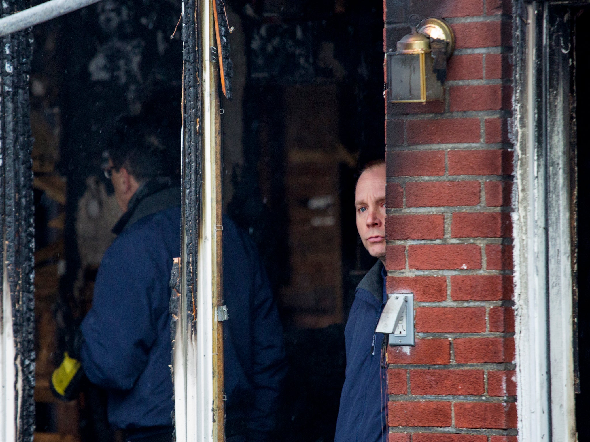 Fire investigators at the scene of the deadly Brooklyn blaze