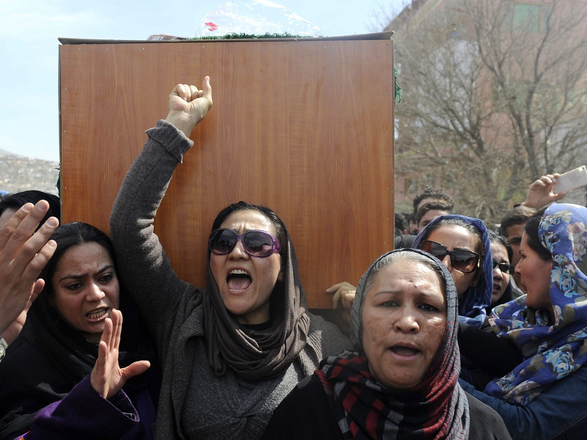 Farkhunda's burial was attended by scores - many of who chanted 'we want justice'