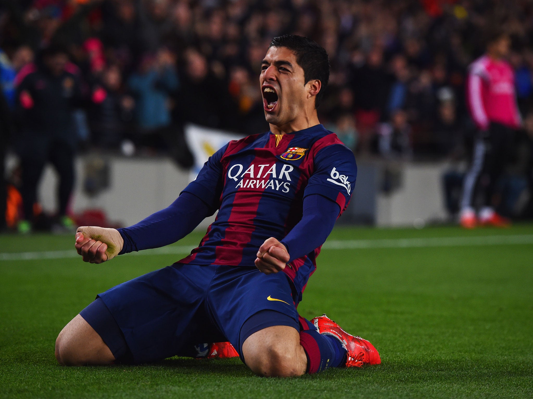 Luis Suarez celebrates scoring for Barcelona against Real Madrid