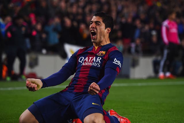 Luis Suarez celebrates scoring for Barcelona against Real Madrid