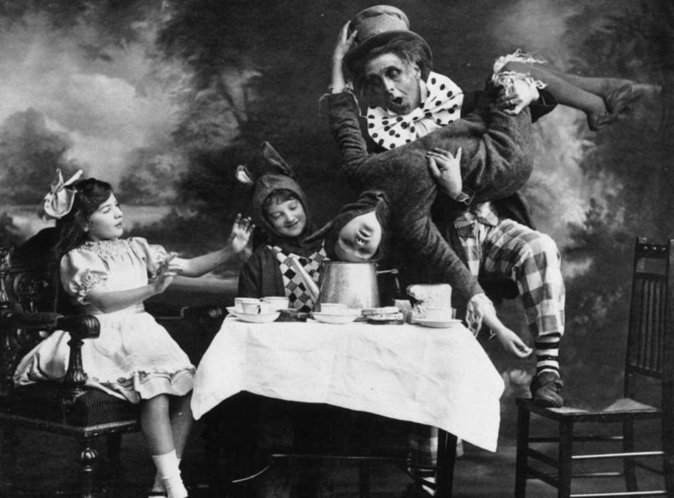Totally potty: 'Alice in Wonderland' is full of strange scenes, such as the Mad Hatter’s tea party, as performed on the London stage in 1910