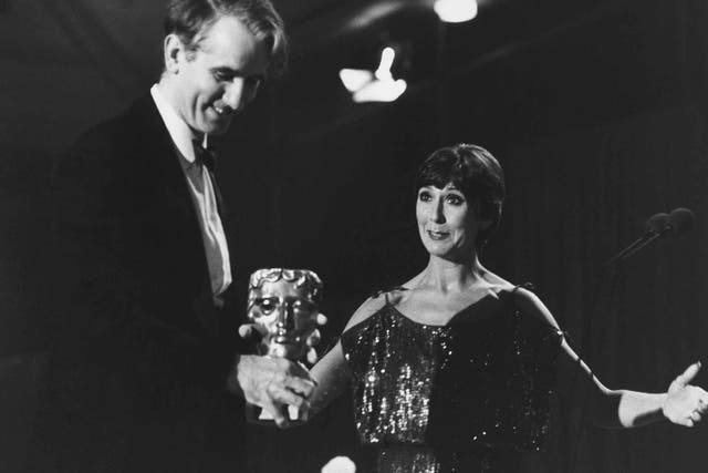 Gowers receives his 1983 Bafta award from Anita Harris 
