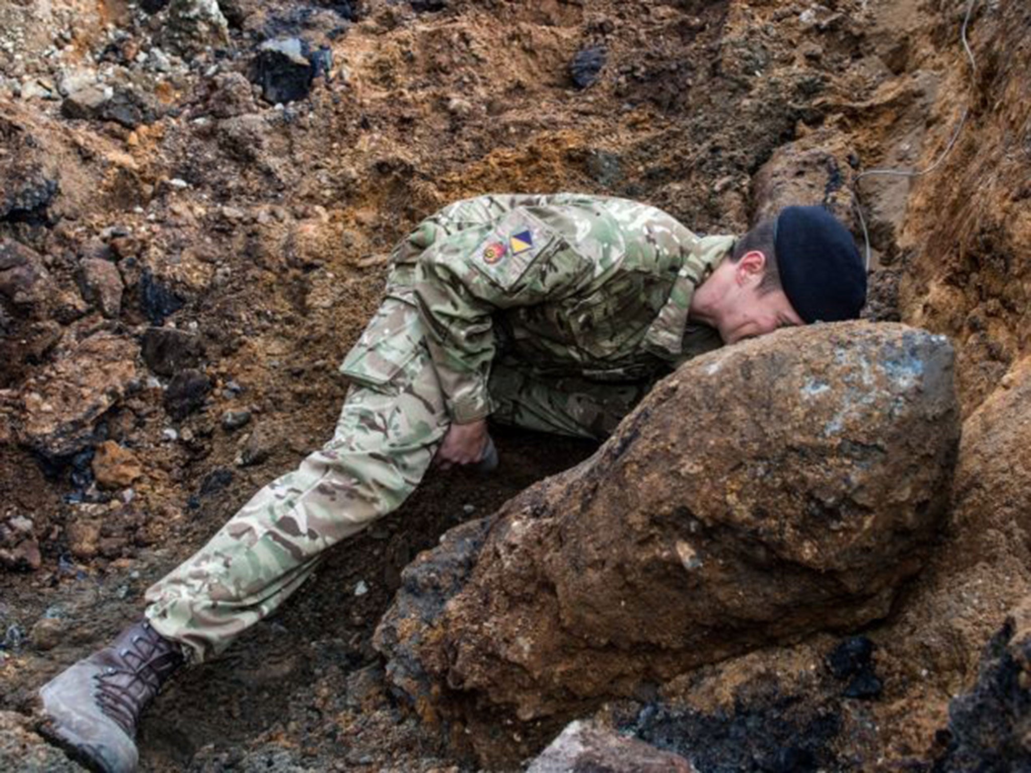 A Royal Logistic Corps Bomb disposal expert checking the fuse on the Second World War 1,000lb bomb found by construction workers in Bermondsey, south-east London.