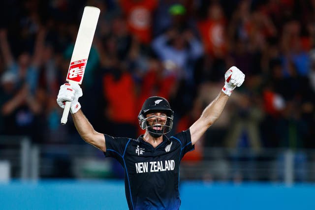 Grant Elliott celebrates hitting a six to win the Cricket World Cup semi-final against South Africa