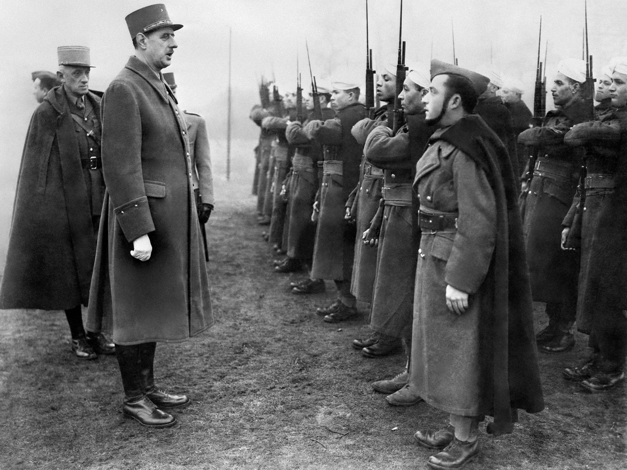 'Charles de Gaulle, Chief of the French Free Forces, inspects the French colonial troops during during his visit of a military base in Great Britain, 1941'
